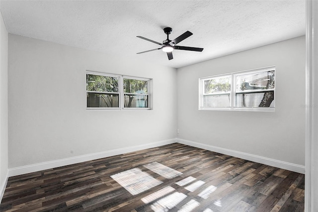 505 Lake Shore Dr, Maitland, FL 32751 - empty room featuring a textured ceiling, a wealth of natural light, and dark wood-style flooring