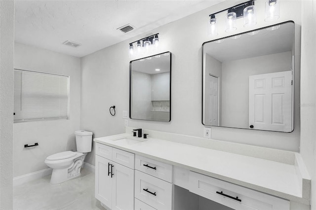 505 Lake Shore Dr, Maitland, FL 32751 - bathroom featuring toilet, vanity, visible vents, and baseboards
