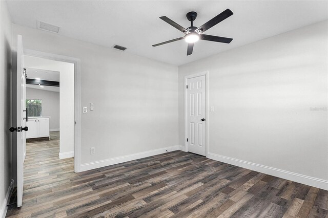 505 Lake Shore Dr, Maitland, FL 32751 - unfurnished bedroom featuring visible vents, baseboards, and dark wood-style flooring