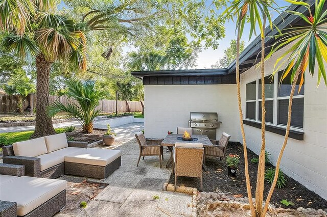 505 Lake Shore Dr, Maitland, FL 32751 - view of patio / terrace with grilling area, outdoor dining area, fence, and an outdoor living space