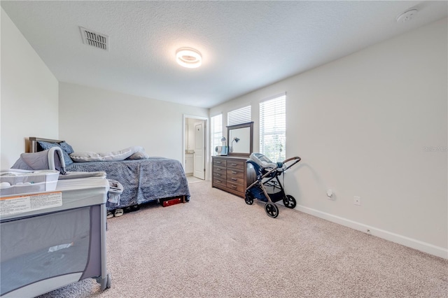 bedroom with visible vents, baseboards, and carpet flooring