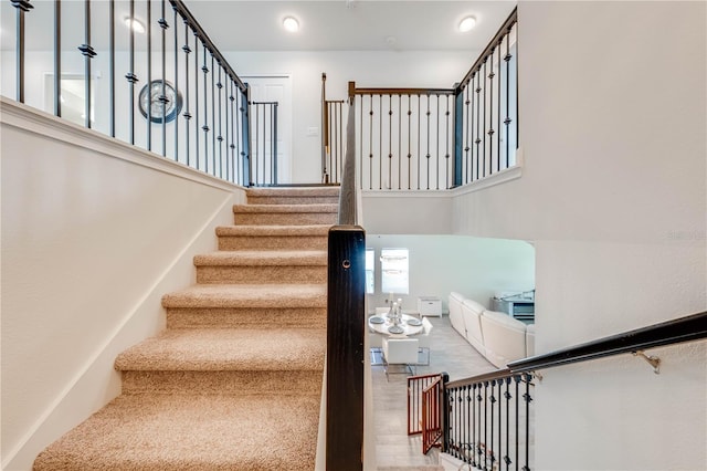 staircase featuring wood finished floors