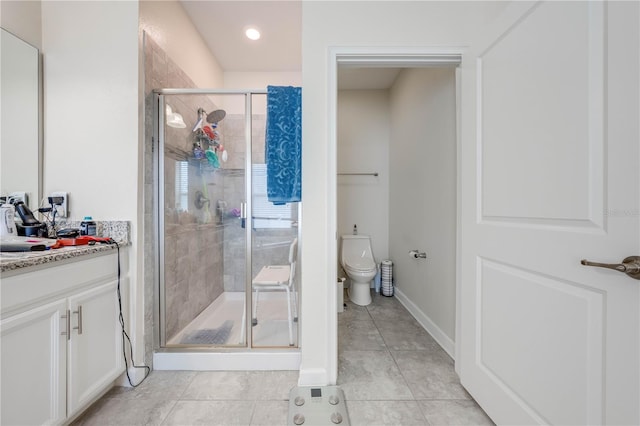 full bathroom with tile patterned flooring, toilet, a stall shower, and vanity