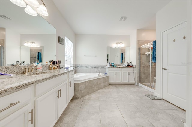 full bath featuring a sink, visible vents, a stall shower, and a garden tub