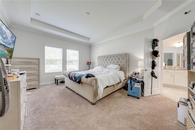 bedroom featuring a raised ceiling, light carpet, and crown molding