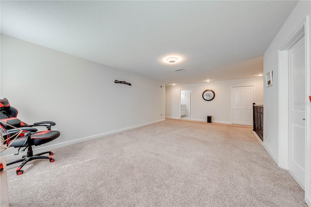 interior space featuring carpet flooring and baseboards