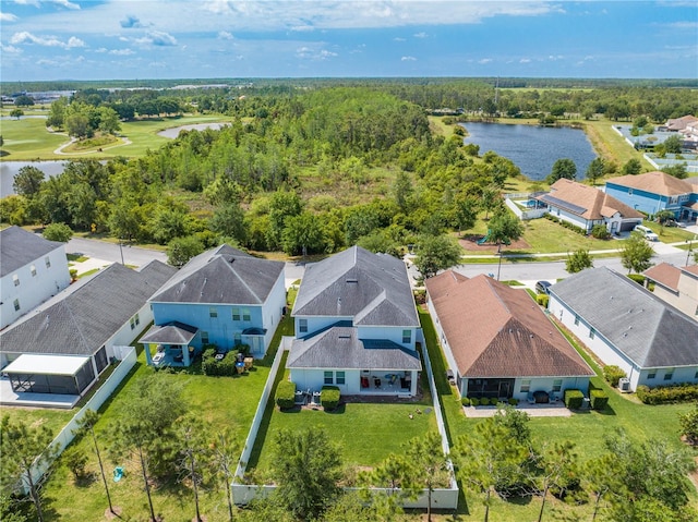 drone / aerial view with a residential view and a water view
