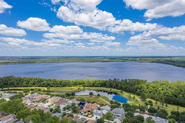 birds eye view of property with a water view and a residential view
