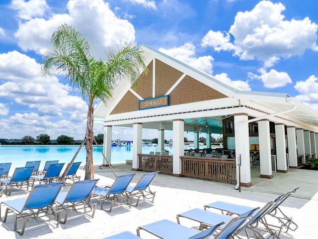 10549 Torchwood Sea Way, San Antonio, FL 33576 - view of patio / terrace with a gazebo, a community pool, and a water view