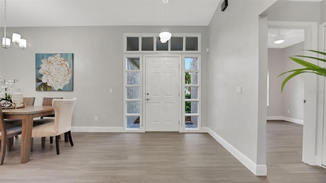 1027 Dees Dr, Oviedo, FL 32765 - foyer entrance with a chandelier and wood finished floors