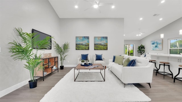 1027 Dees Dr, Oviedo, FL 32765 - living area with ceiling fan, lofted ceiling, light wood-type flooring, and recessed lighting