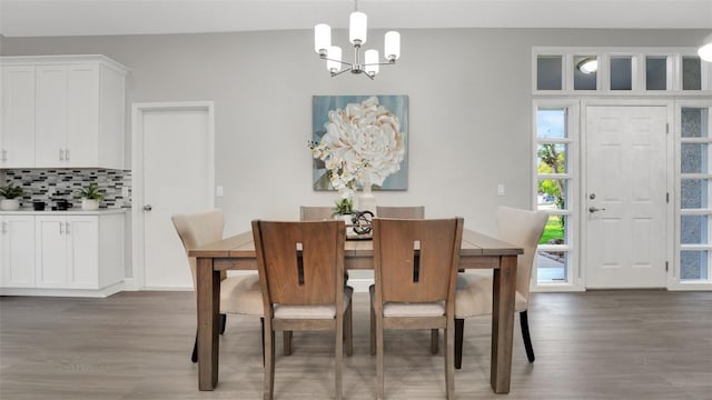1027 Dees Dr, Oviedo, FL 32765 - dining area featuring a chandelier and wood finished floors
