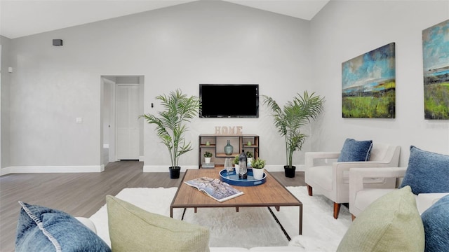 1027 Dees Dr, Oviedo, FL 32765 - living room featuring wood finished floors and lofted ceiling