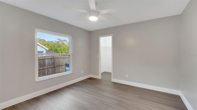 1027 Dees Dr, Oviedo, FL 32765 - unfurnished room with wood finished floors and a ceiling fan