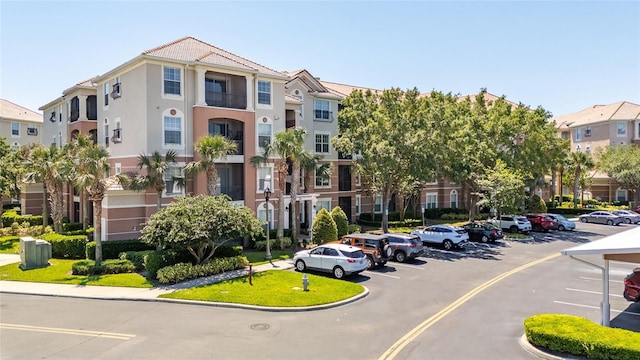 8296 Portofino Dr Unit 405, Davenport, FL 33896 - view of property with a residential view and uncovered parking
