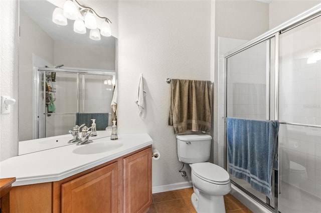 8296 Portofino Dr Unit 405, Davenport, FL 33896 - full bath featuring toilet, a textured wall, vanity, tile patterned flooring, and a stall shower