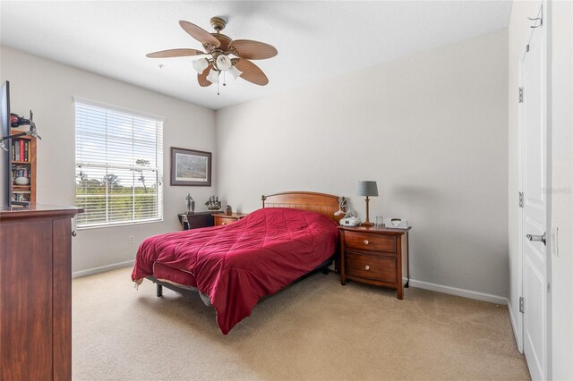 8296 Portofino Dr Unit 405, Davenport, FL 33896 - carpeted bedroom with baseboards and ceiling fan