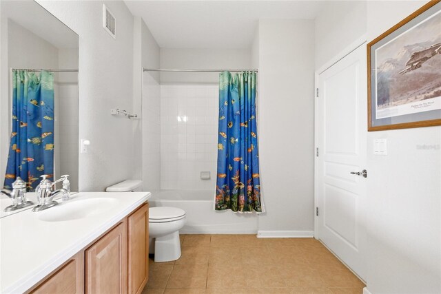 8296 Portofino Dr Unit 405, Davenport, FL 33896 - full bathroom featuring shower / bathtub combination with curtain, vanity, tile patterned flooring, visible vents, and toilet