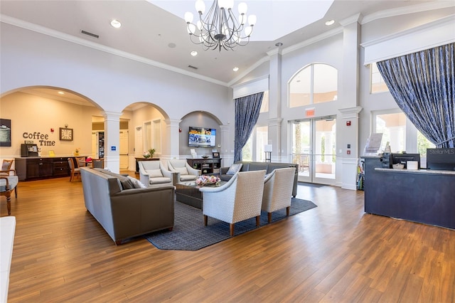 8296 Portofino Dr Unit 405, Davenport, FL 33896 - living area with ornate columns, wood finished floors, visible vents, and arched walkways