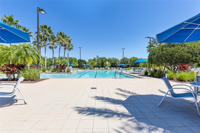 8296 Portofino Dr Unit 405, Davenport, FL 33896 - community pool featuring a patio