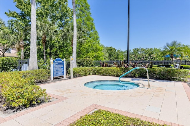 8296 Portofino Dr Unit 405, Davenport, FL 33896 - view of pool featuring fence and a hot tub
