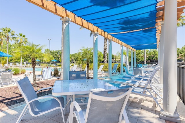 8296 Portofino Dr Unit 405, Davenport, FL 33896 - view of patio / terrace with outdoor dining space and a community pool