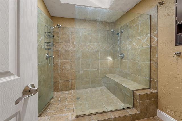 bathroom featuring tiled shower