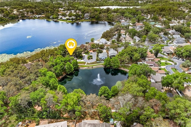 birds eye view of property featuring a residential view and a water view