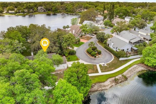 birds eye view of property with a residential view and a water view