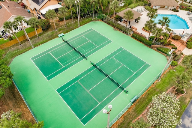 view of sport court with fence