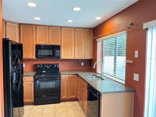 600 Fallsmead Cir, Longwood, FL 32750 - kitchen featuring black appliances, a sink, recessed lighting, stone countertops, and light tile patterned floors