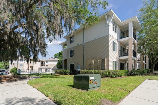 3921 SW 34th St Unit 102, Gainesville, FL 32608 - view of home's exterior with a yard