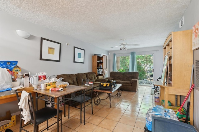 3921 SW 34th St Unit 102, Gainesville, FL 32608 - living room featuring light tile patterned floors, a textured ceiling, and ceiling fan