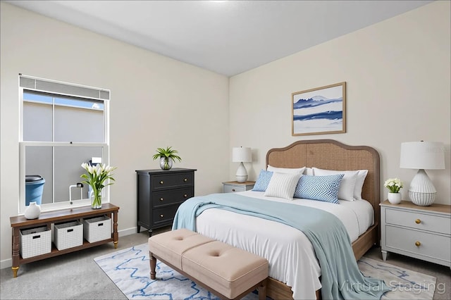 carpeted bedroom with baseboards