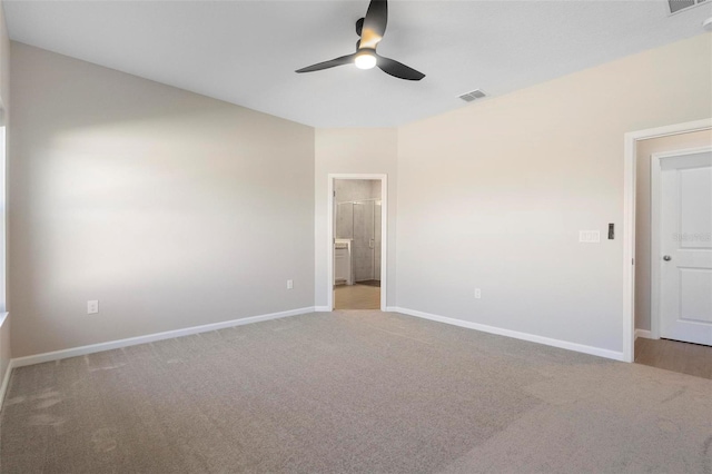 unfurnished bedroom with visible vents, baseboards, carpet floors, and ensuite bathroom