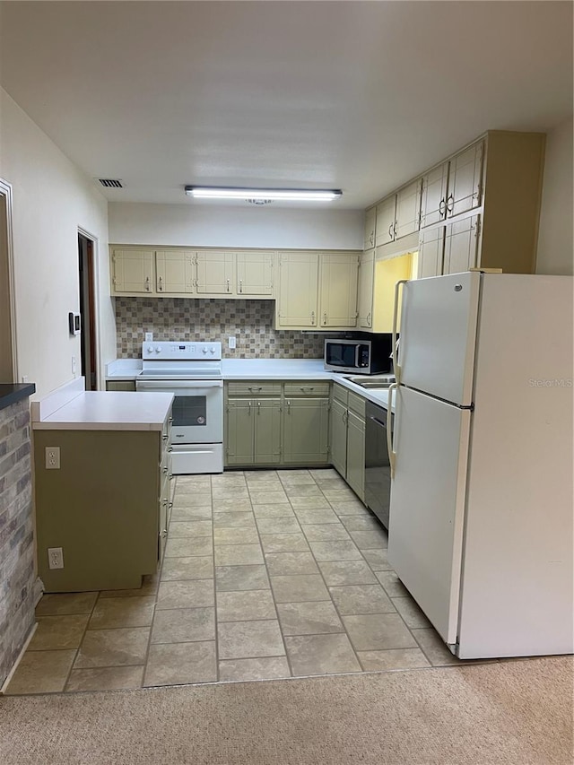 275 Virginia Dr, Winter Garden, FL 34787 - kitchen featuring visible vents, light countertops, backsplash, and appliances with stainless steel finishes