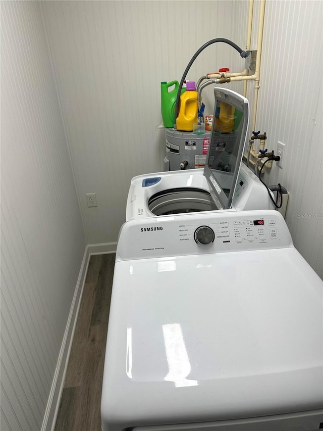 2902 Little Rd, Valrico, FL 33596 - washroom with washer / clothes dryer, baseboards, and wood finished floors