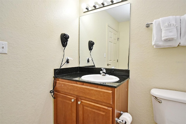 8112 Poinciana Blvd Unit 1809, Orlando, FL 32821 - half bath featuring toilet, a textured wall, and vanity