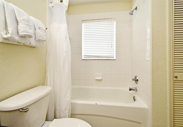 8112 Poinciana Blvd Unit 1809, Orlando, FL 32821 - bathroom with toilet, a closet, a textured wall, and shower / tub combo