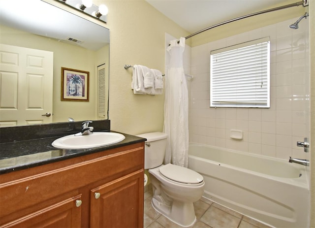 8112 Poinciana Blvd Unit 1809, Orlando, FL 32821 - full bathroom featuring tile patterned floors, shower / bath combination with curtain, toilet, vanity, and visible vents