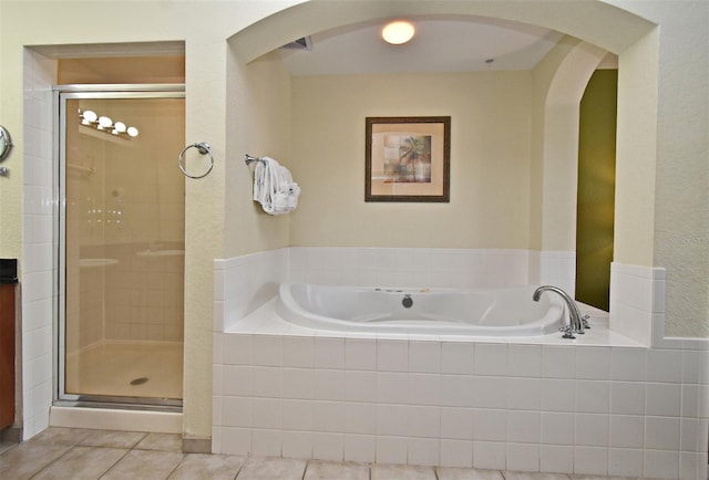 8112 Poinciana Blvd Unit 1809, Orlando, FL 32821 - full bathroom featuring a garden tub, tile patterned flooring, and a shower stall