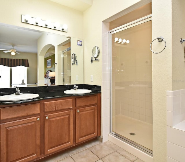 8112 Poinciana Blvd Unit 1809, Orlando, FL 32821 - ensuite bathroom featuring a stall shower, tile patterned floors, and ensuite bathroom