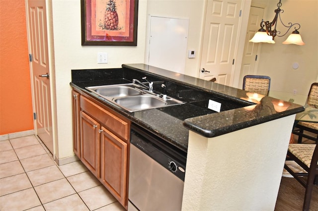 8112 Poinciana Blvd Unit 1809, Orlando, FL 32821 - kitchen featuring light tile patterned floors, stainless steel dishwasher, a sink, a kitchen bar, and a peninsula