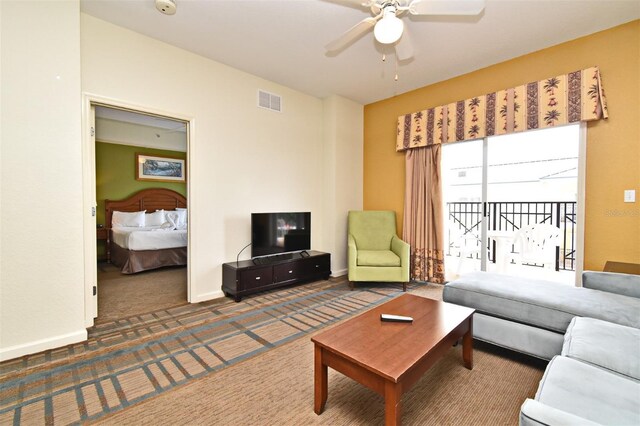 8112 Poinciana Blvd Unit 1809, Orlando, FL 32821 - carpeted living room with visible vents, a ceiling fan, and baseboards
