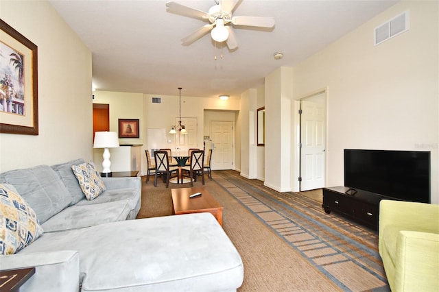 8112 Poinciana Blvd Unit 1809, Orlando, FL 32821 - living area featuring visible vents, ceiling fan, baseboards, and carpet floors