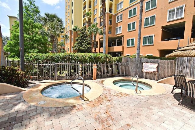 8112 Poinciana Blvd Unit 1809, Orlando, FL 32821 - view of pool featuring fence and a hot tub
