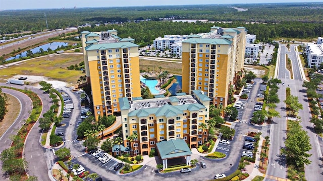 8112 Poinciana Blvd Unit 1809, Orlando, FL 32821 - drone / aerial view featuring a water view and a view of trees
