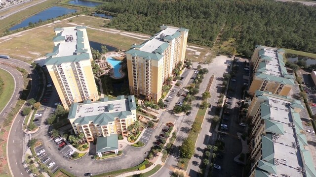 8112 Poinciana Blvd Unit 1809, Orlando, FL 32821 - bird's eye view featuring a wooded view and a water view