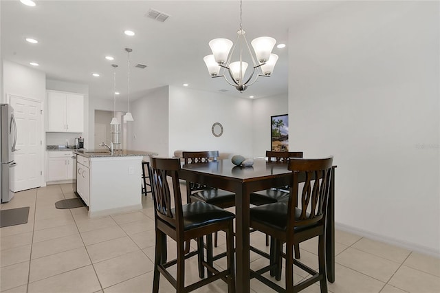 dining space featuring visible vents, recessed lighting, light tile patterned floors, and an inviting chandelier