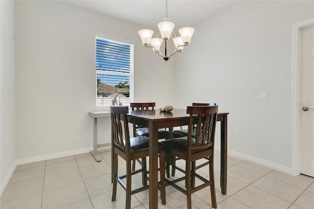 dining room with baseboards, an inviting chandelier, and light tile patterned floors